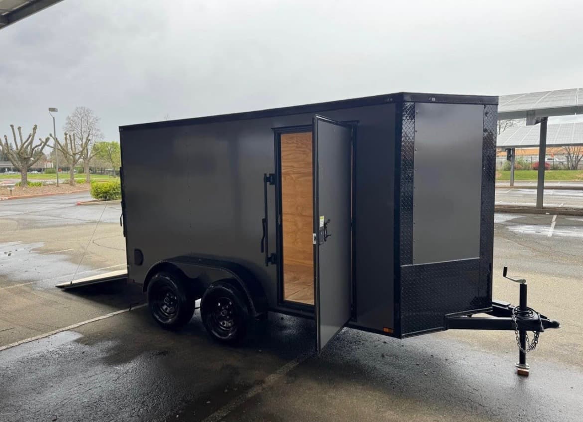 Reliable Movers Edmonton enclosed trailer with side door open